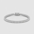 A silver tennis bracelet with a continuous row of round-cut clear stones and a secure clasp, shown on a light gray background.