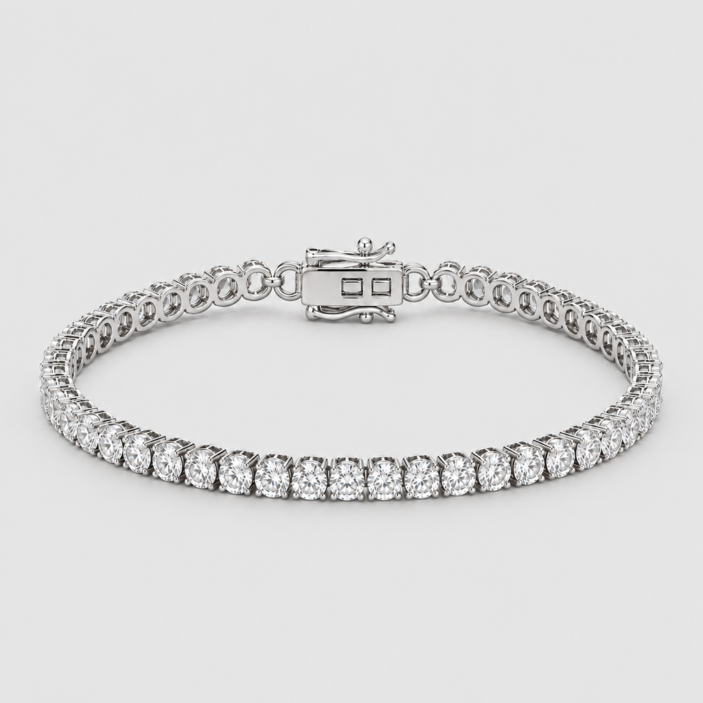 A silver tennis bracelet with a row of round-cut clear gemstones, displayed on a light gray background.