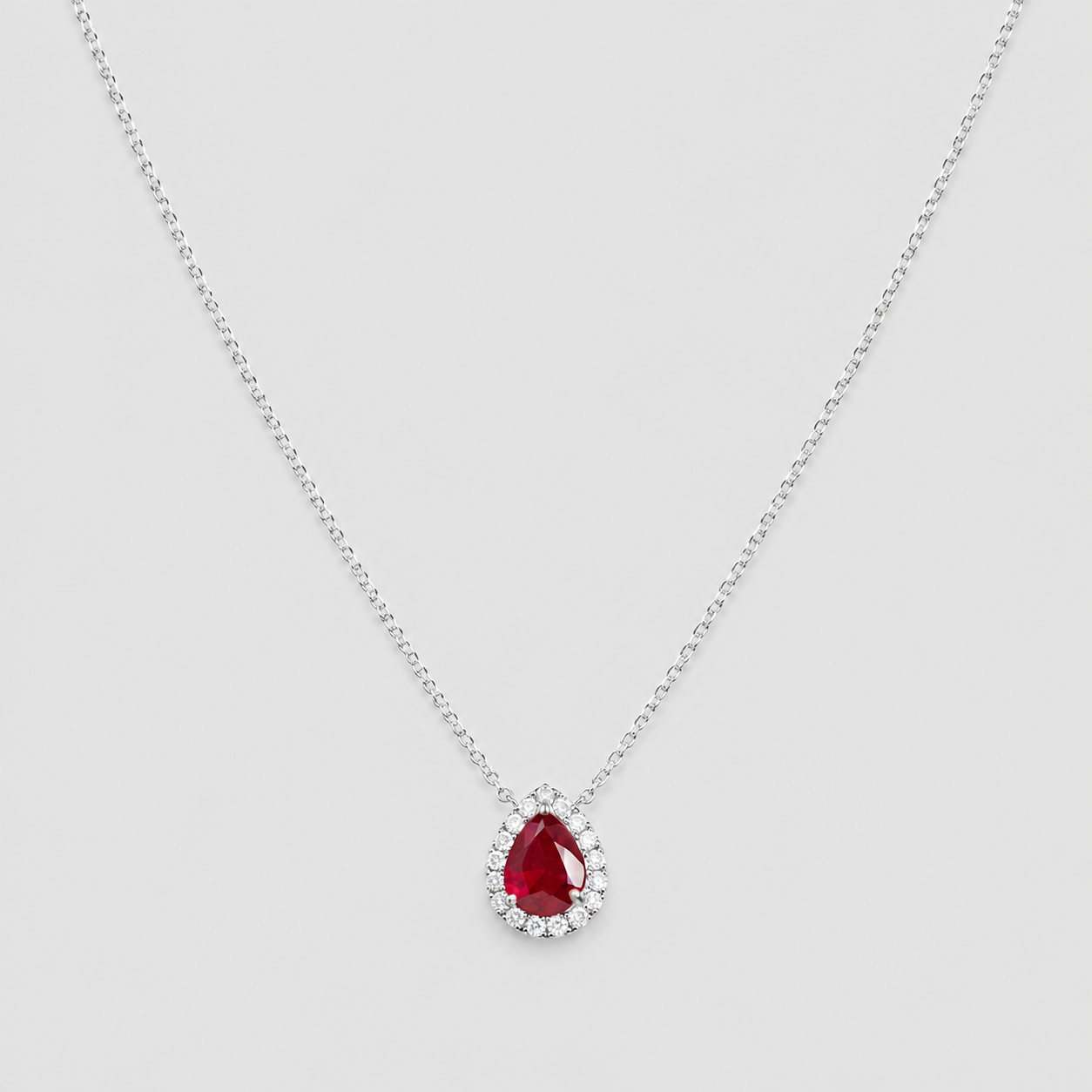 1.30 Ct. Pear Cut Ruby Halo Pendant Necklace with Lab-Grown Diamonds
