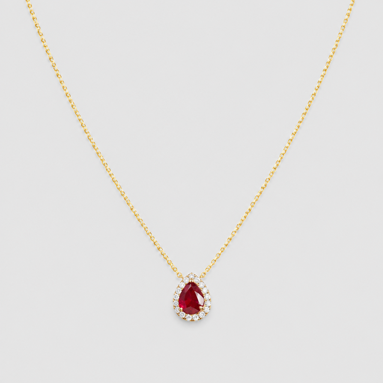 1.30 Ct. Pear Cut Ruby Halo Pendant Necklace with Lab-Grown Diamonds