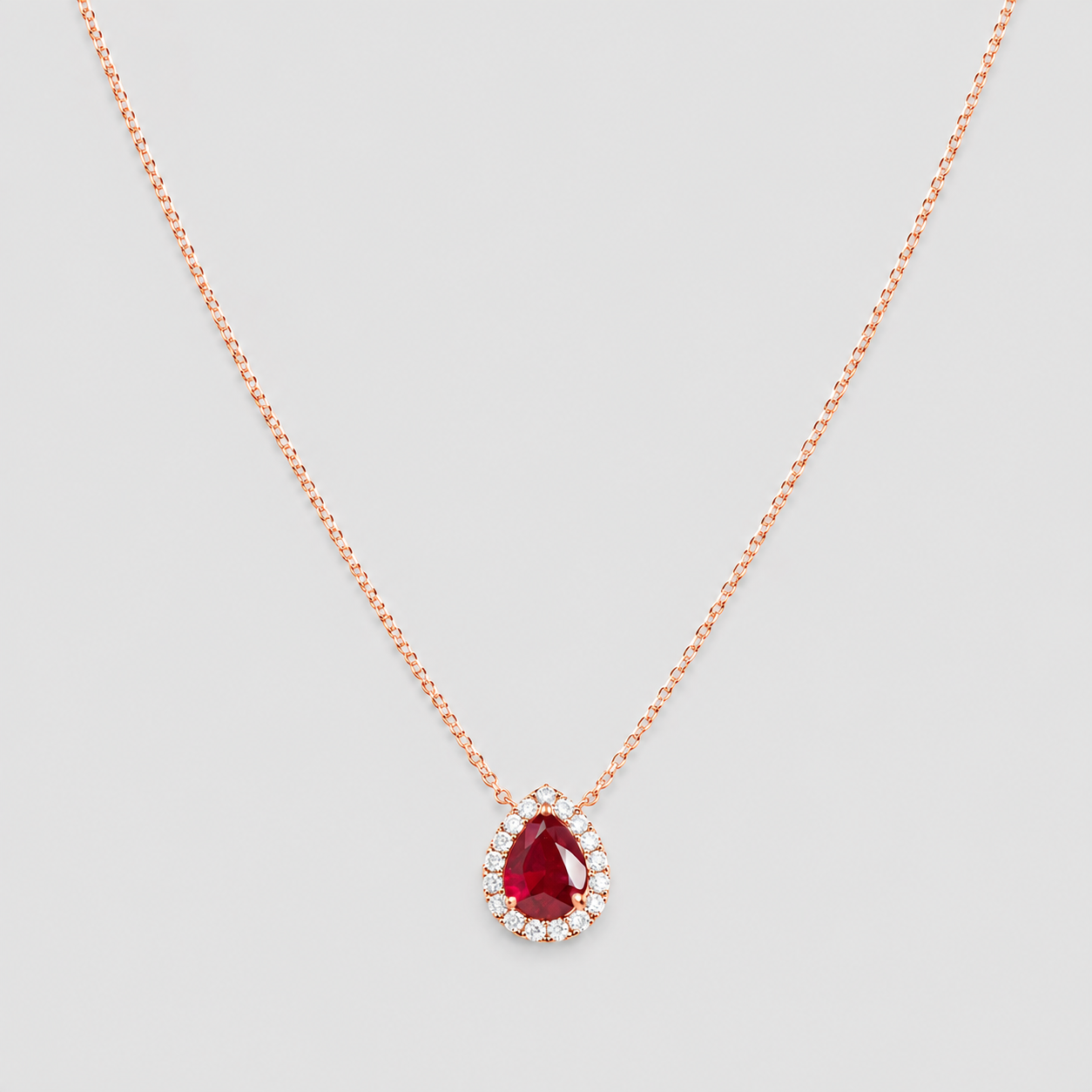 1.30 Ct. Pear Cut Ruby Halo Pendant Necklace with Lab-Grown Diamonds