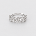 A silver band ring adorned with marquise-cut and round diamonds, photographed on a clean, light gray background.