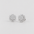 A pair of round cluster stud earrings set with clear gemstones in a silver-toned metal, displayed on a clean light gray background.