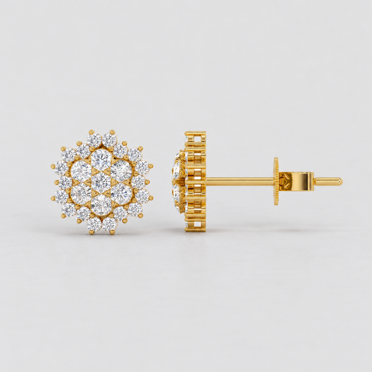 A pair of gold stud earrings with a circular cluster of clear gemstones, shown from the front and side on a light gray background.