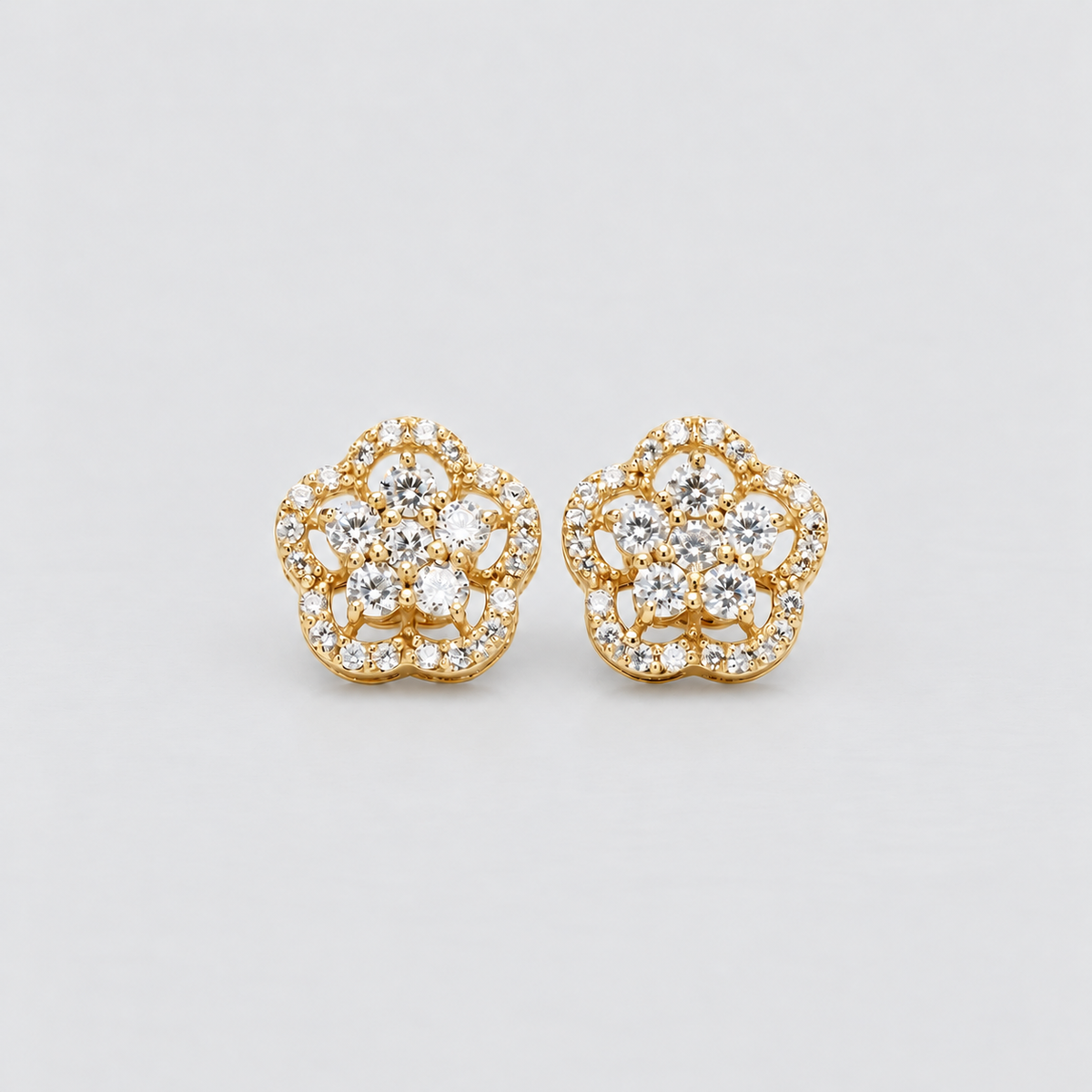 Floral diamond cluster stud earrings in yellow gold