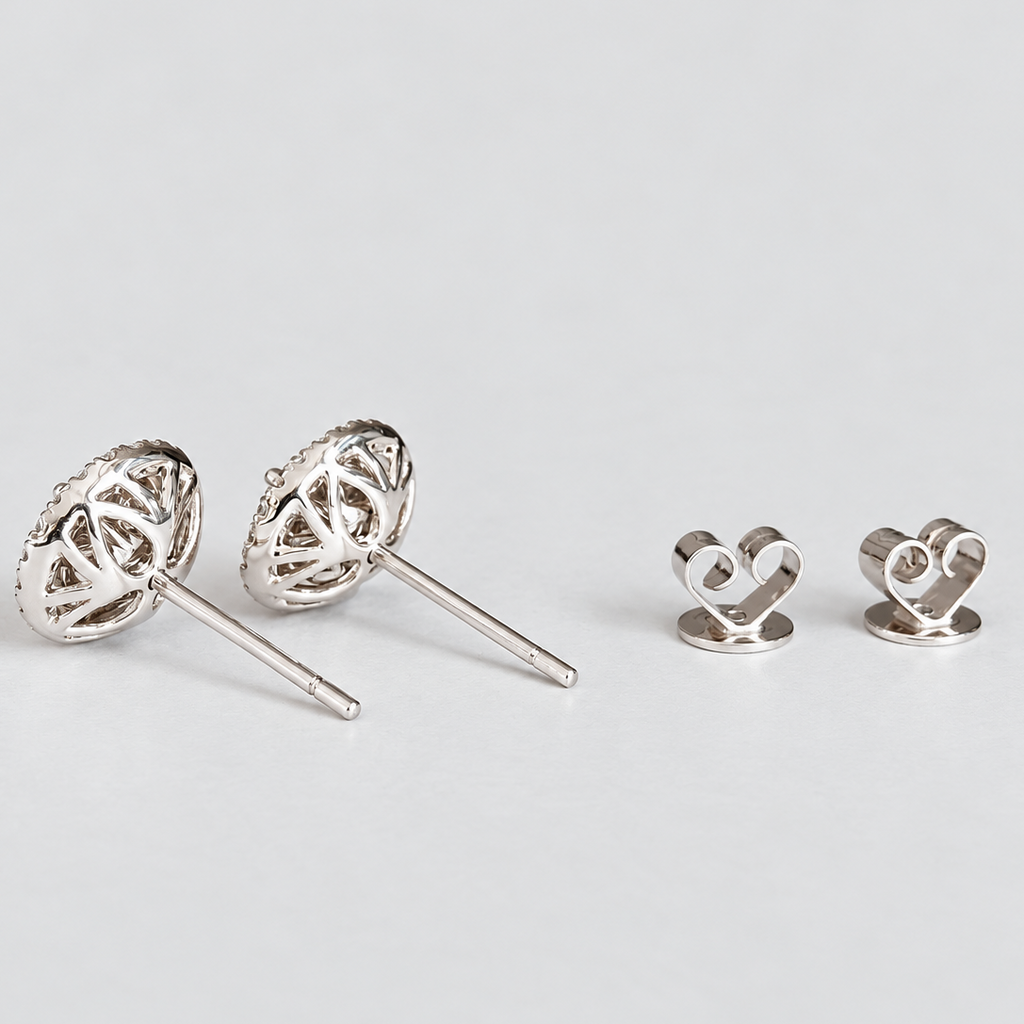 Side view of women's round cluster diamond stud earrings with ear nuts.
