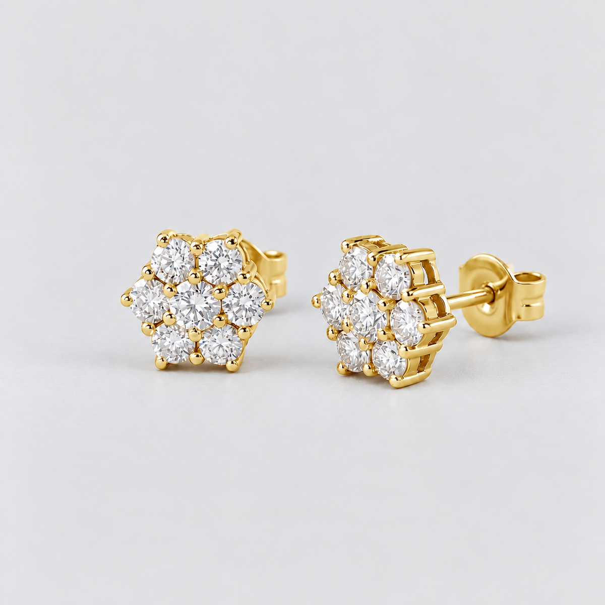 Pair of women's round flower cluster lab-grown diamond stud earrings set in yellow gold.
