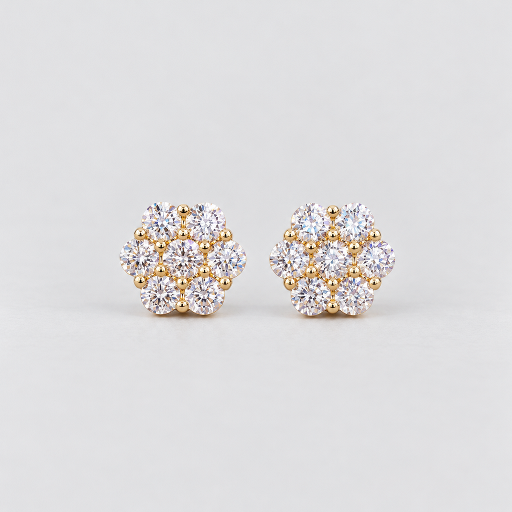 A pair of women's diamond cluster stud earrings in a hexagonal floral pattern in yellow gold metal.