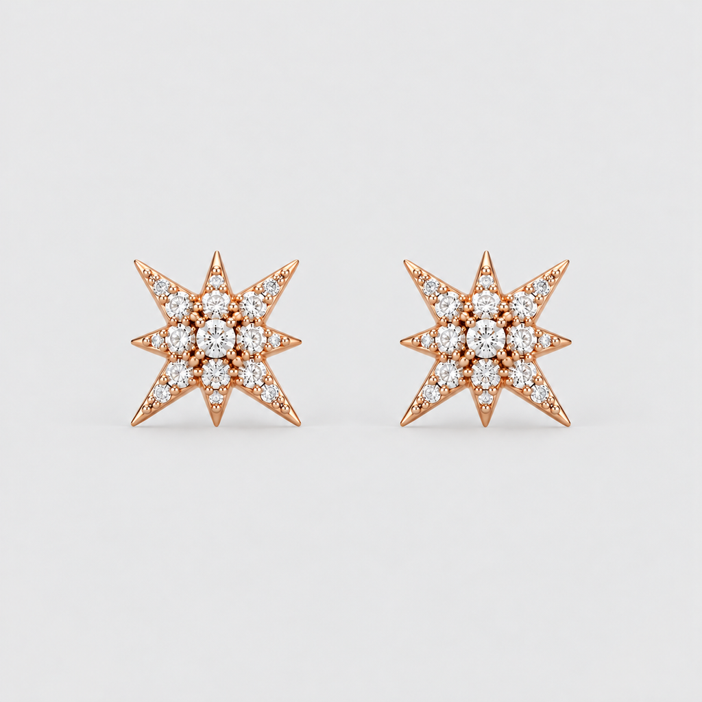 A pair of rose gold starburst stud earrings set with round diamonds, displayed on a clean light gray background.