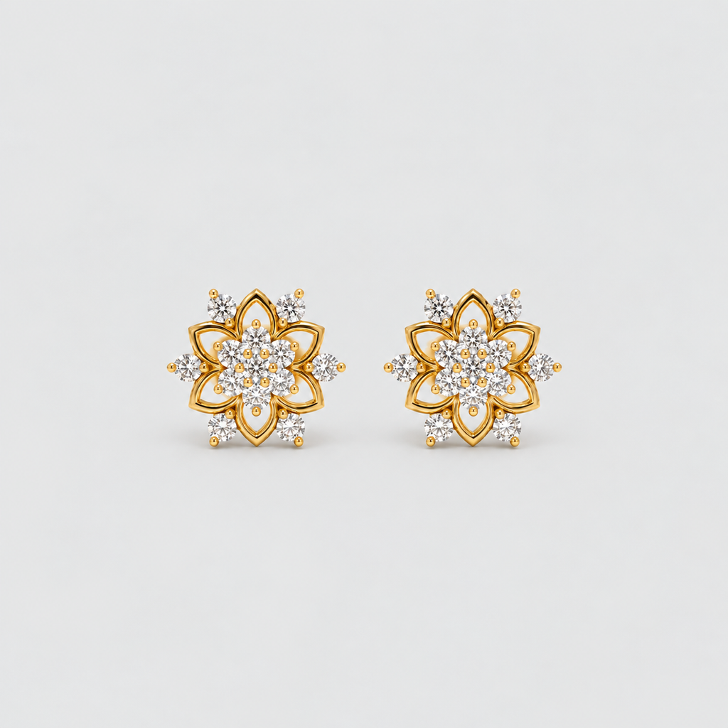 A pair of gold flower-shaped stud earrings set with clear gemstones, displayed on a clean light gray background.