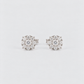 A pair of round cluster stud earrings featuring a central clear gemstone surrounded by multiple smaller clear stones in a silver-toned setting, photographed on a clean light gray background.