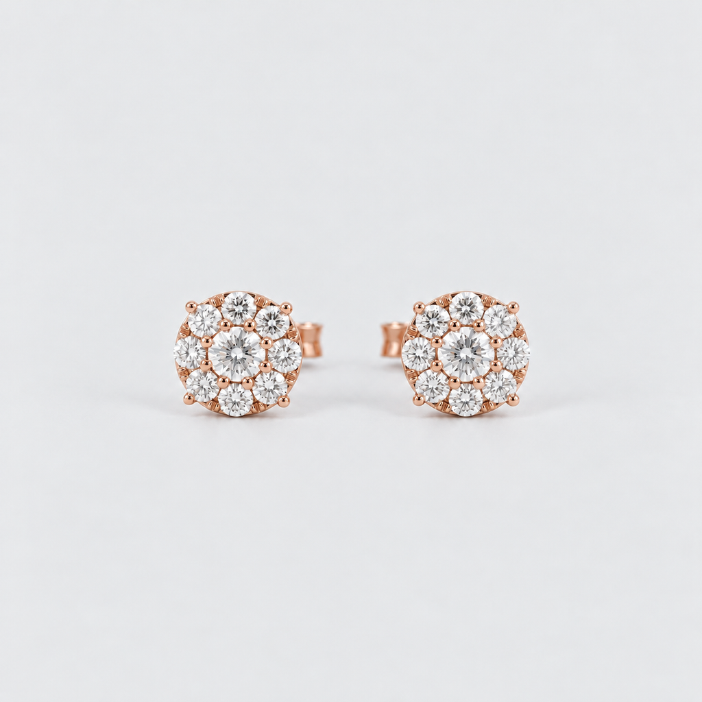 A pair of rose gold stud earrings with round-cut clear gemstones arranged in a flower-like cluster, photographed on a clean light gray background.