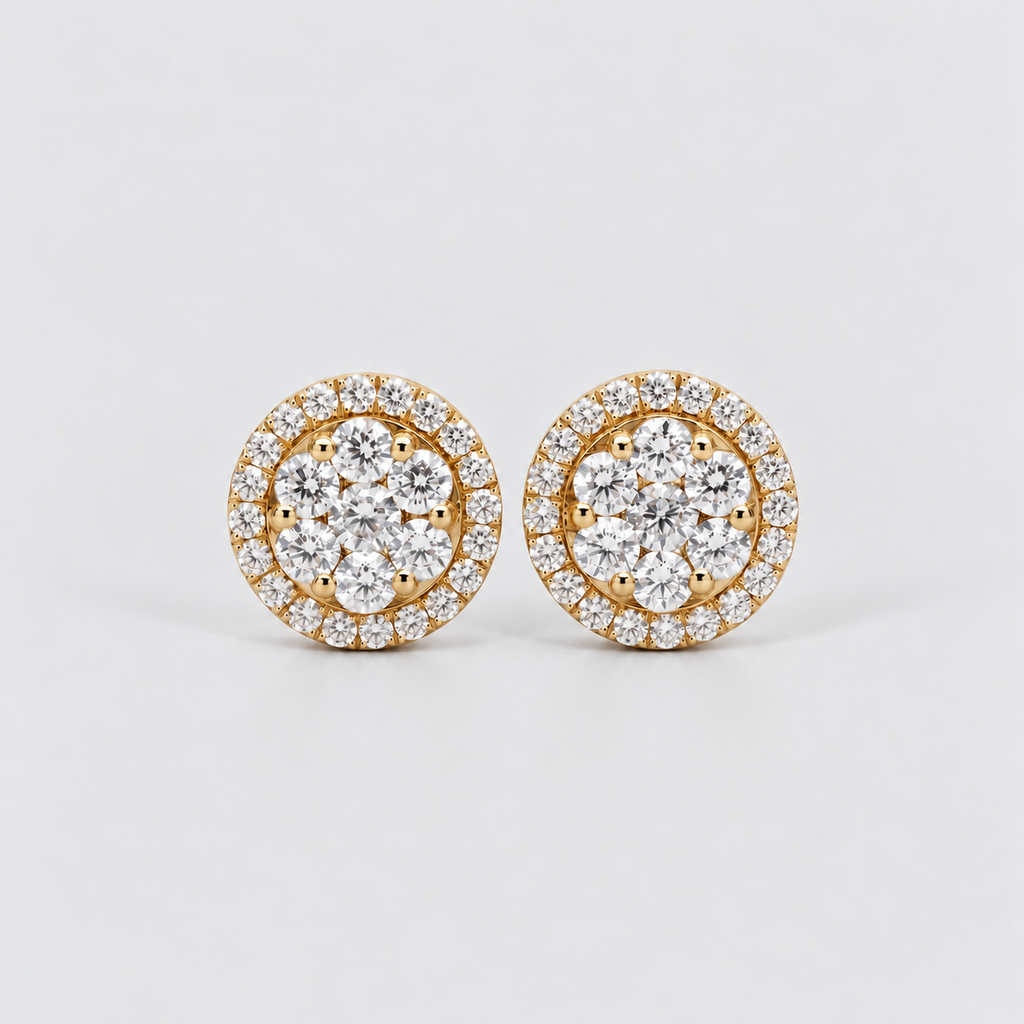 A pair of round yellow gold stud earrings set with multiple round-cut clear gemstones in a halo and cluster design, photographed on a clean light gray background.