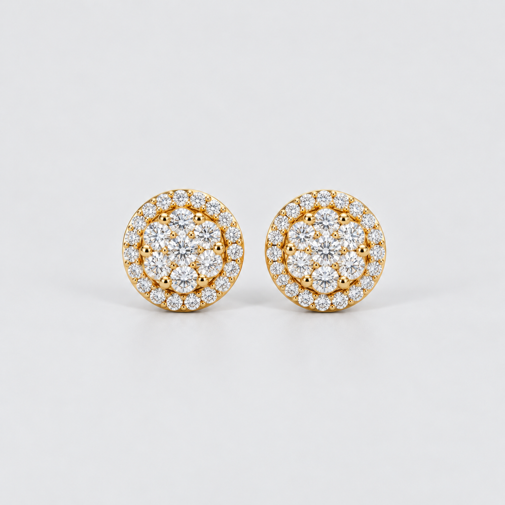 A pair of round gold stud earrings set with multiple clear gemstones in a halo and cluster design, photographed on a clean light gray background.