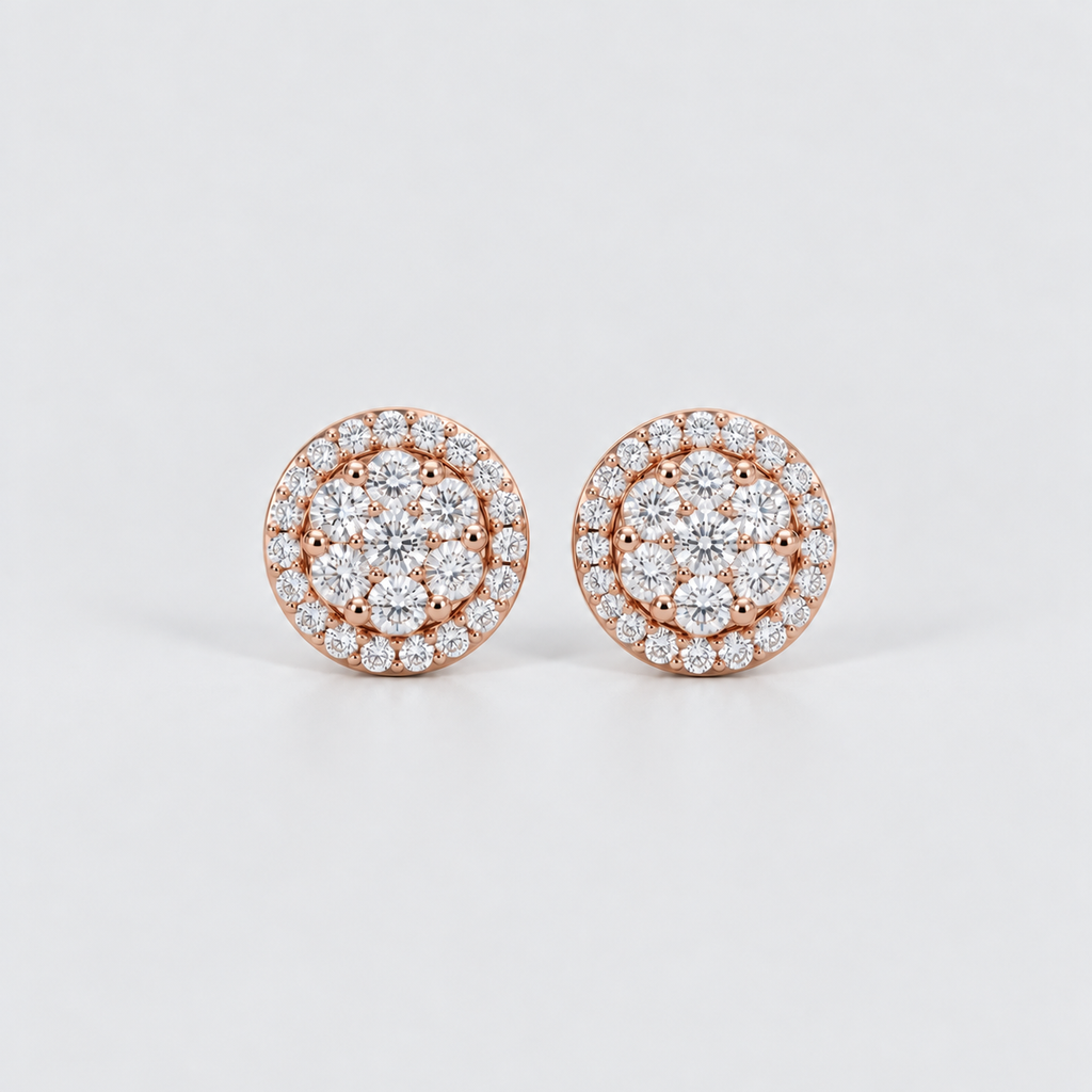 A pair of round rose gold stud earrings set with multiple clear gemstones in a halo design, photographed on a clean light gray background.