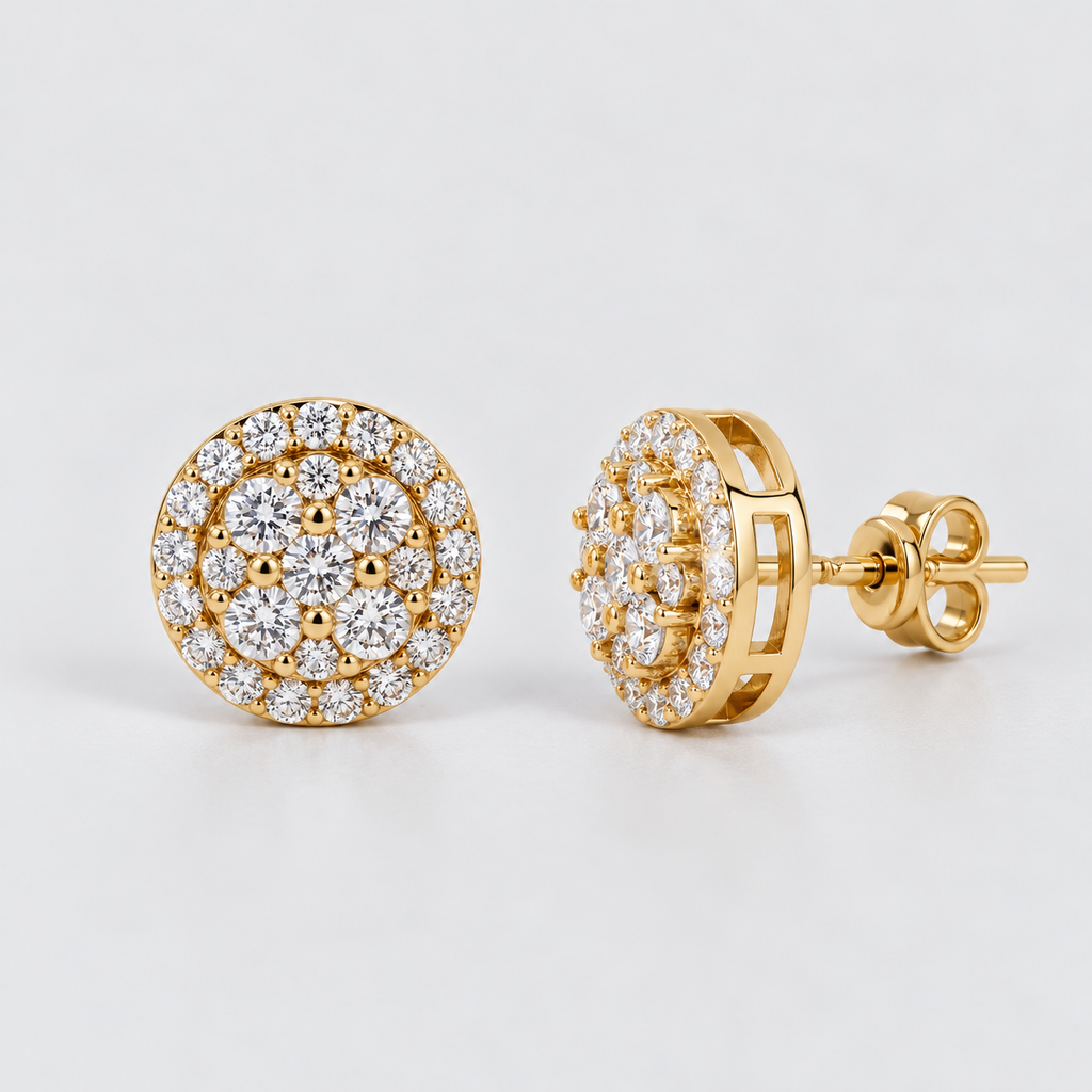 A pair of gold round stud earrings set with multiple round clear gemstones, shown on a light gray background. One earring is shown from the front, and the other is shown from the side/back.