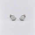 A pair of silver-toned heart-shaped stud earrings paved with small clear stones, displayed on a clean light gray reflective surface.