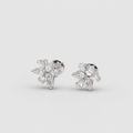 A pair of silver-toned stud earrings with marquise-cut clear gemstones arranged in a small floral or snowflake-like cluster, photographed on a clean light gray background.