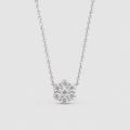 A silver-toned necklace with a small flower-shaped cluster of clear stones on a delicate chain, shown against a light gray background.