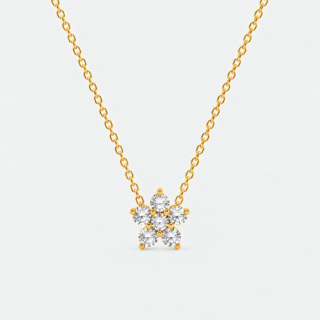 A delicate gold chain necklace with a small flower-shaped pendant set with clear round-cut gemstones, shown against a plain light gray background.