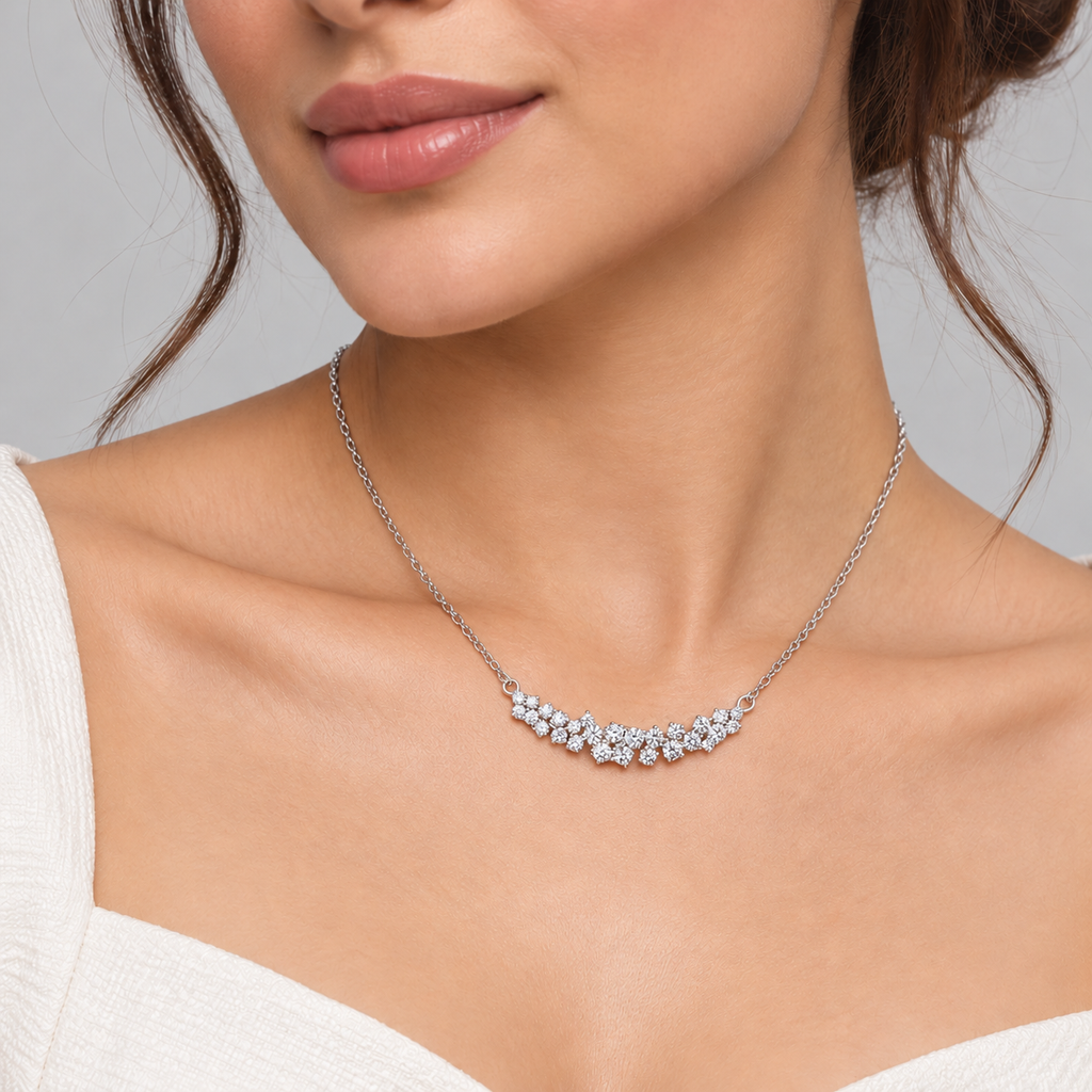 Women's cluster diamond pendant necklace in white gold showcased on a model.