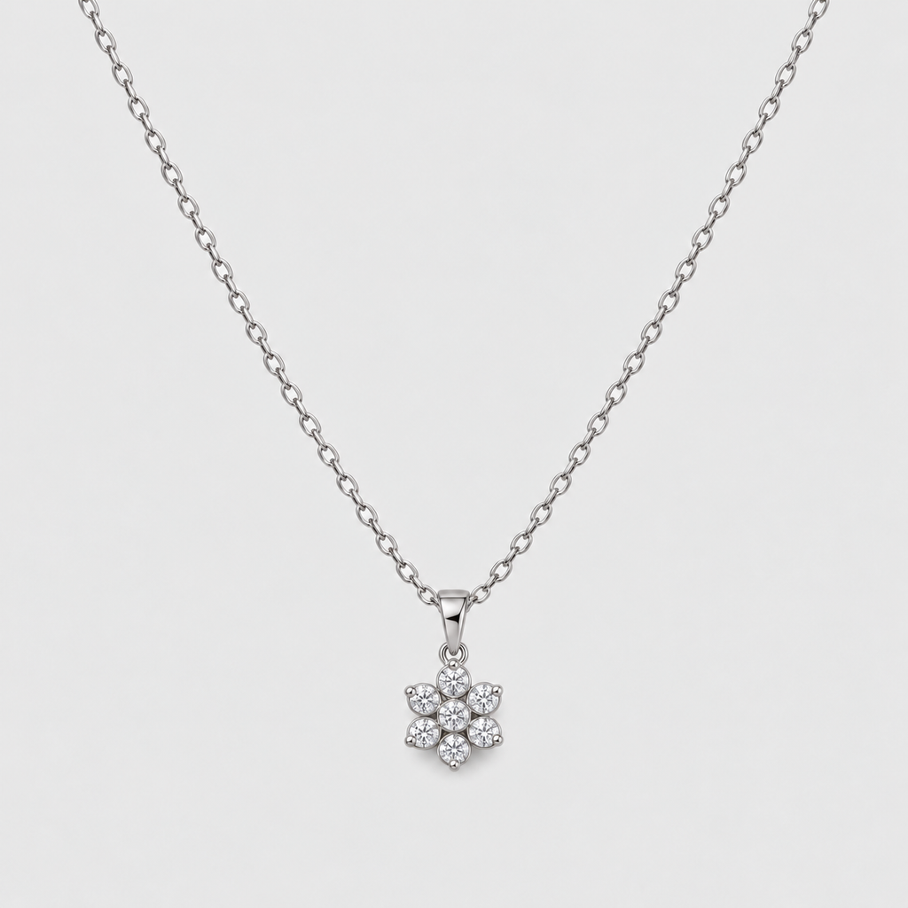 Cluster diamond pendant necklace with a delicate white gold chain.