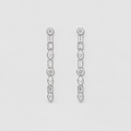 A pair of silver-toned drop earrings with a vertical arrangement of clear gemstones in round, baguette, and marquise shapes, set against a plain light gray background.