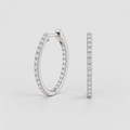 A pair of silver hoop earrings paved with small clear stones, shown from the front and side against a light gray background.