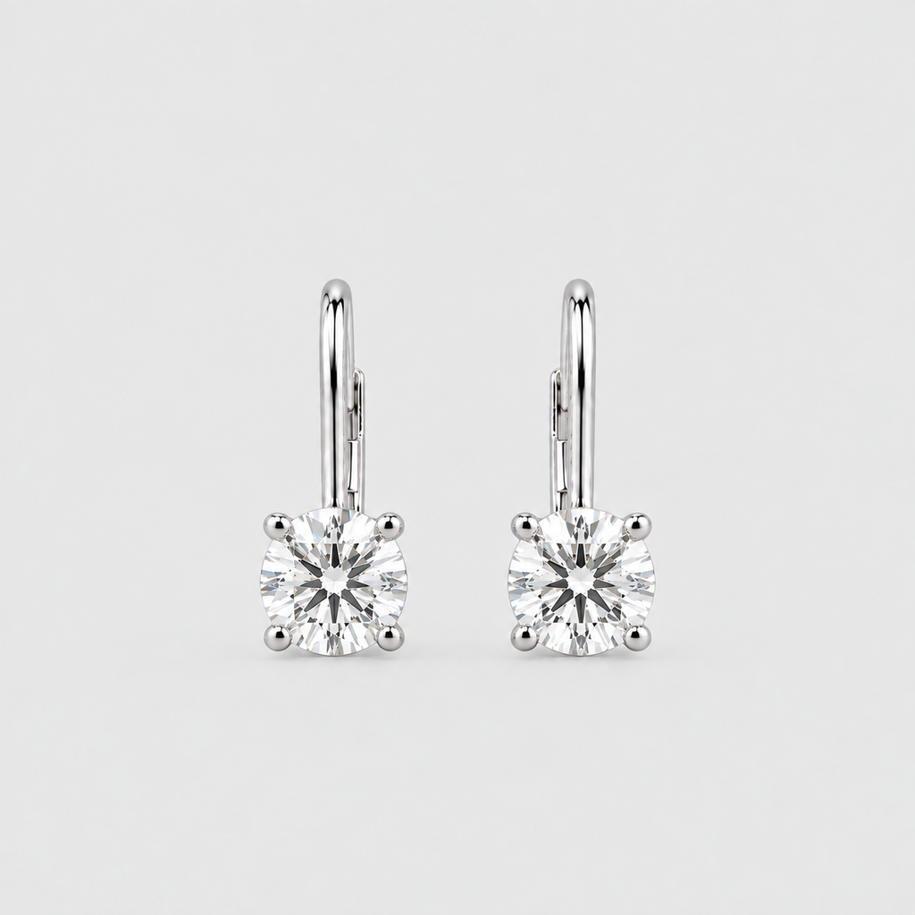 A pair of silver leverback earrings with square-cut clear gemstones in four-prong settings, shown on a light gray background.