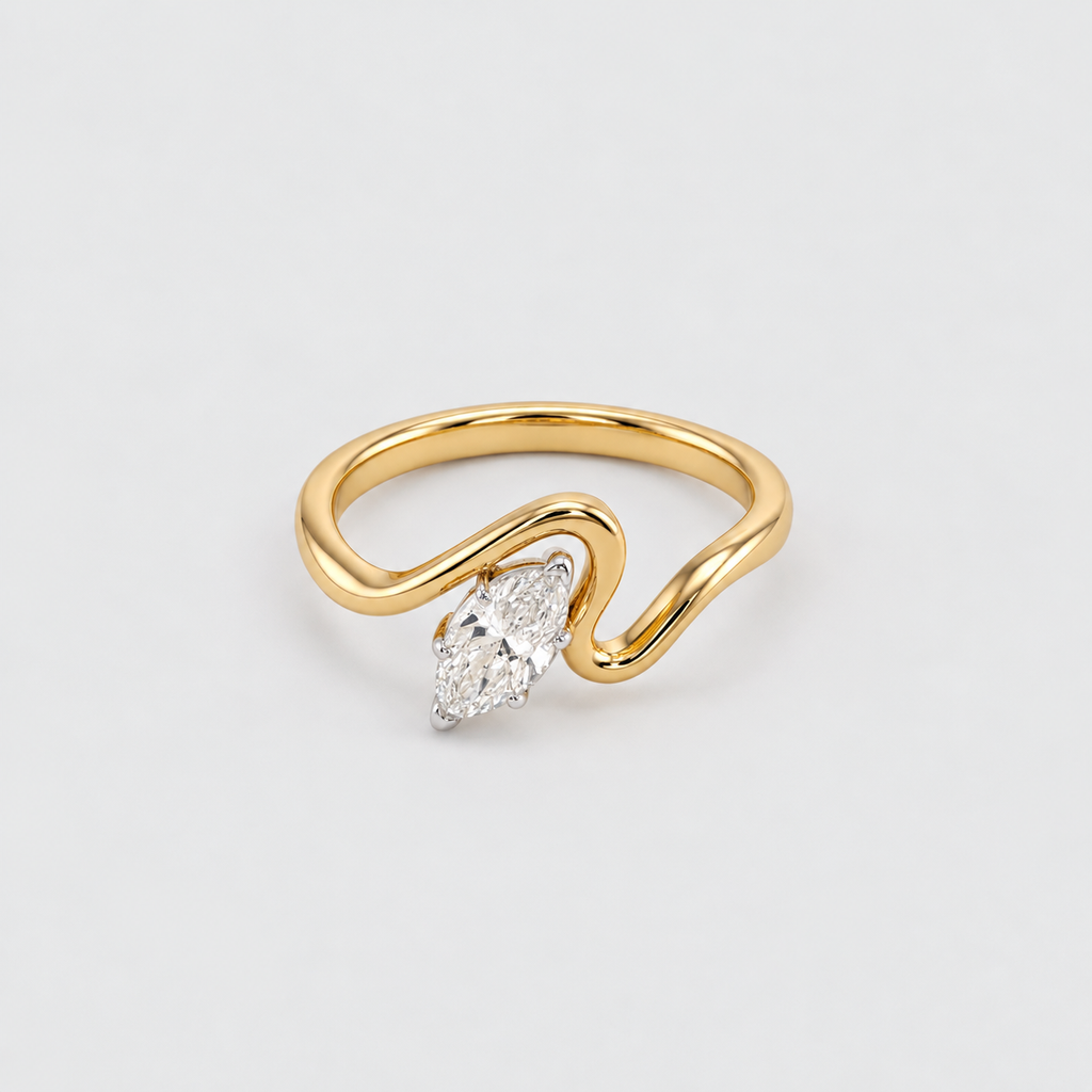 A gold ring with a wavy, open band design and a marquise-cut diamond set in a silver-colored prong, shown on a light gray background.