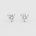 A pair of round-cut diamond stud earrings in a three-prong setting, shown on a light gray background.
