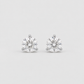 A pair of round-cut stud earrings in a silver-toned setting, photographed on a clean light gray background.