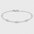 A silver chain bracelet with five oval eye-shaped links, each set with a small clear gemstone, displayed on a light gray background.