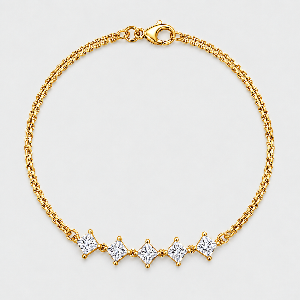 A gold chain bracelet with five diamond-shaped clear gemstones set in a row, displayed on a light gray background.