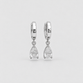 A pair of silver huggie hoop earrings with teardrop-shaped clear gemstones, shown against a light gray background.