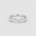 A silver band ring featuring a row of marquise-cut and round-cut clear gemstones, photographed on a light gray background.