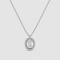 An oval halo pendant necklace featuring a brilliant-cut center stone surrounded by a halo of small pavé-set stones, suspended from a delicate silver-toned chain against a light gray background.