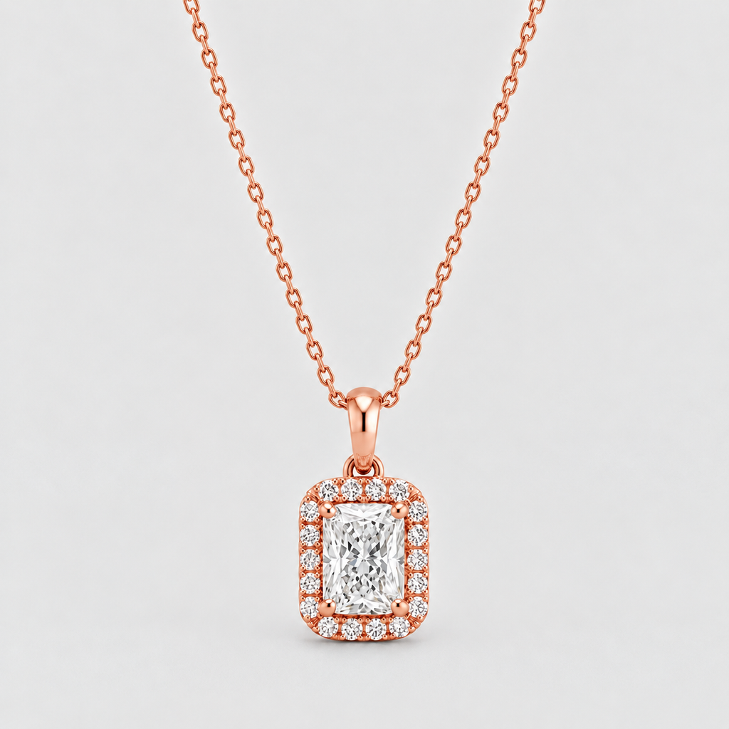 A rose gold necklace with a rectangular halo pendant featuring a central emerald-cut diamond surrounded by smaller round diamonds, shown on a light gray background.