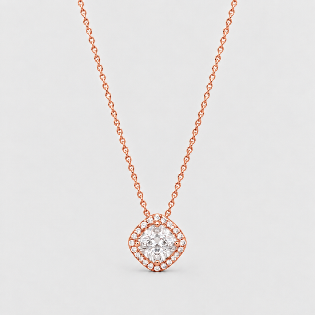 A rose gold necklace with a diamond halo pendant, shown against a light gray background.