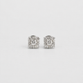 A pair of square-shaped halo stud earrings in silver-toned metal, featuring a central round clear gemstone surrounded by smaller clear stones, set against a plain light gray background.