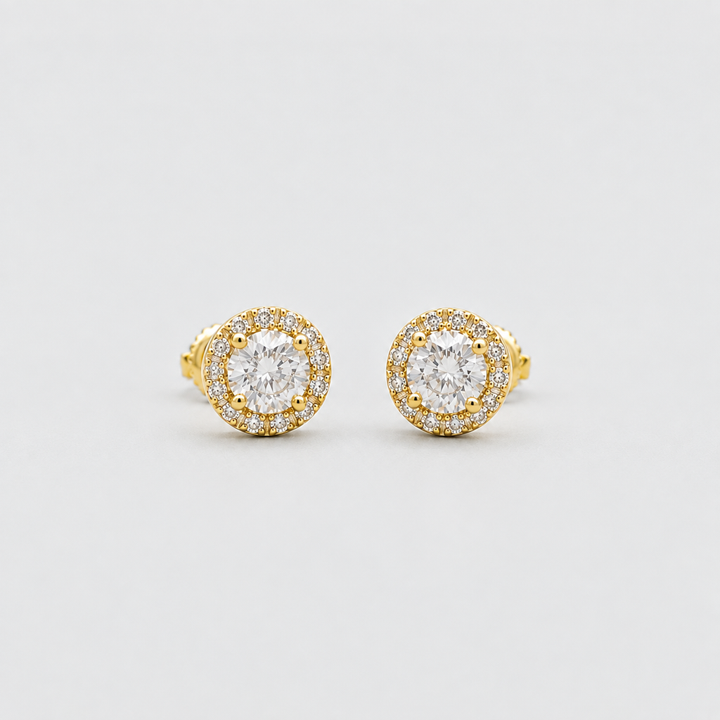 A pair of yellow gold halo stud earrings with round-cut clear gemstones, displayed on a clean light gray background.