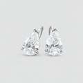 A pair of pear-cut diamond stud earrings in a silver four-prong setting, shown against a clean light gray background.