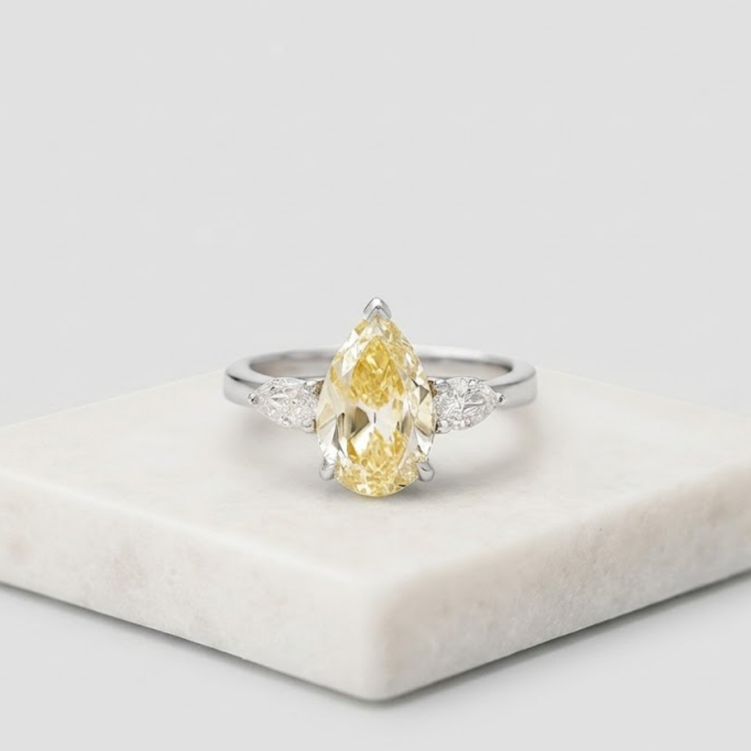 4.00tcw (VS-Fancy Yellow) Fancy Yellow Pear Three Stone Lab Grown Diamond Ring