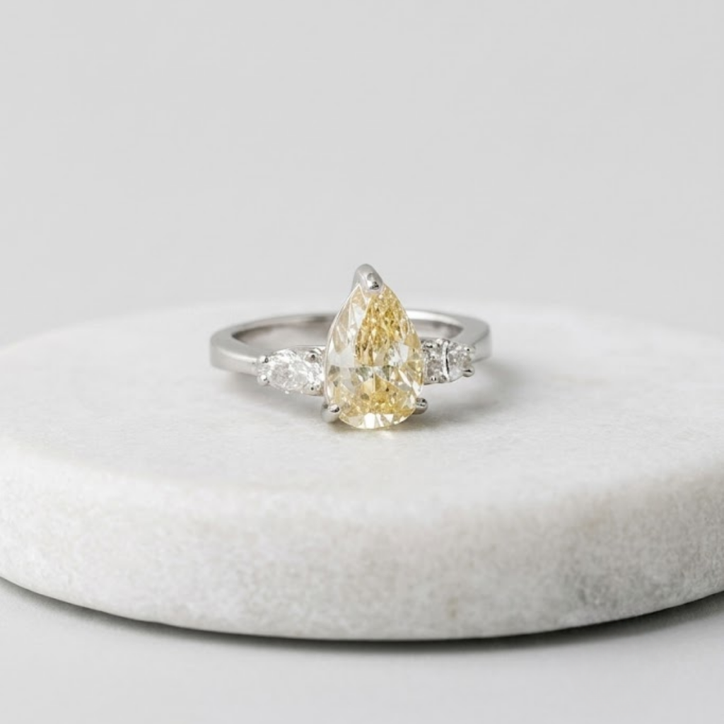 4.00tcw (VS-Fancy Yellow) Fancy Yellow Pear Three Stone Lab Grown Diamond Ring