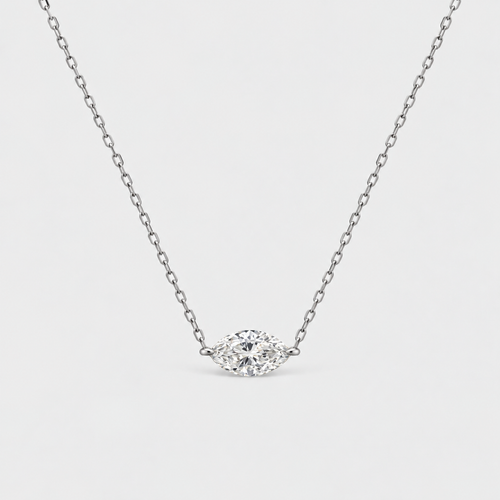 A delicate silver chain necklace featuring an eye-shaped marquise-cut diamond pendant, shown against a clean light gray background.