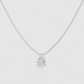 A delicate silver chain necklace with a pear-cut diamond pendant in a prong setting, displayed against a light gray background.