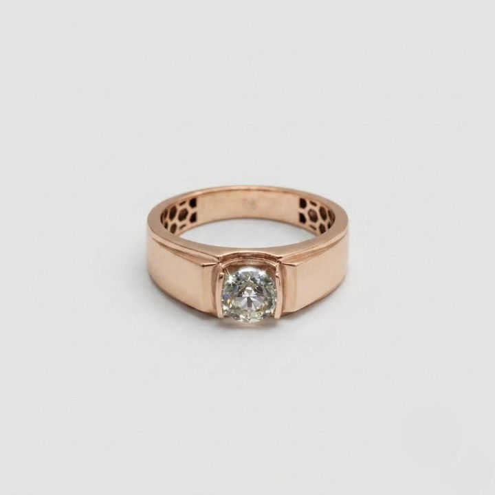 A rose gold ring with a round-cut clear gemstone in a prong setting, shown on a light gray background.