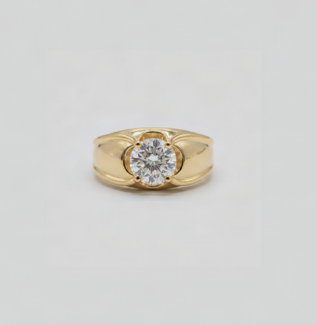 Gold ring with diamond accents on a white background