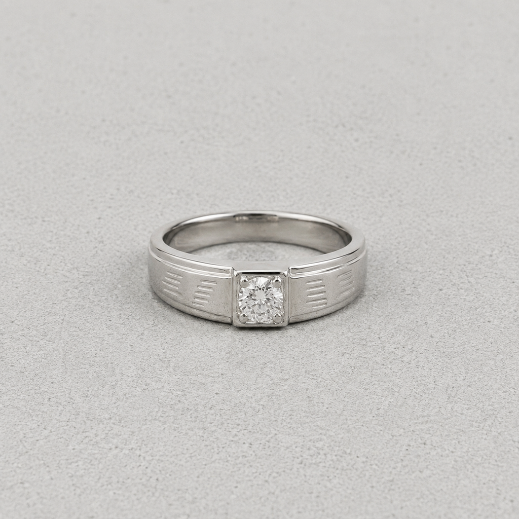 A silver ring with a square-cut diamond set in a decorative bezel, shown on a textured gray background.