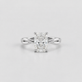 An radiant cut diamond engagement ring with a silver-colored split-shank band, centered on a light gray background.